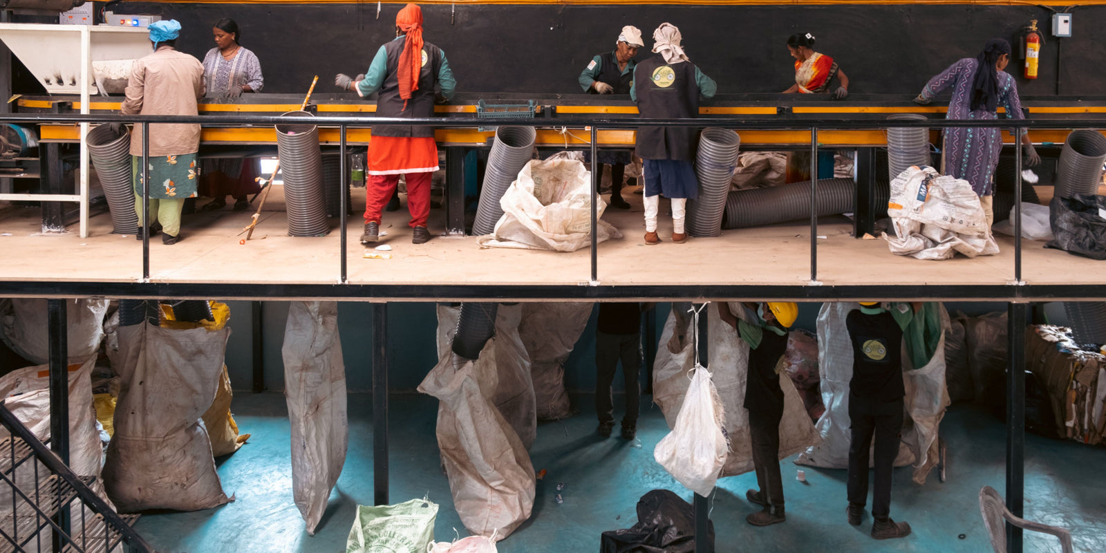 Cleanhub workers sorting plastic waste.