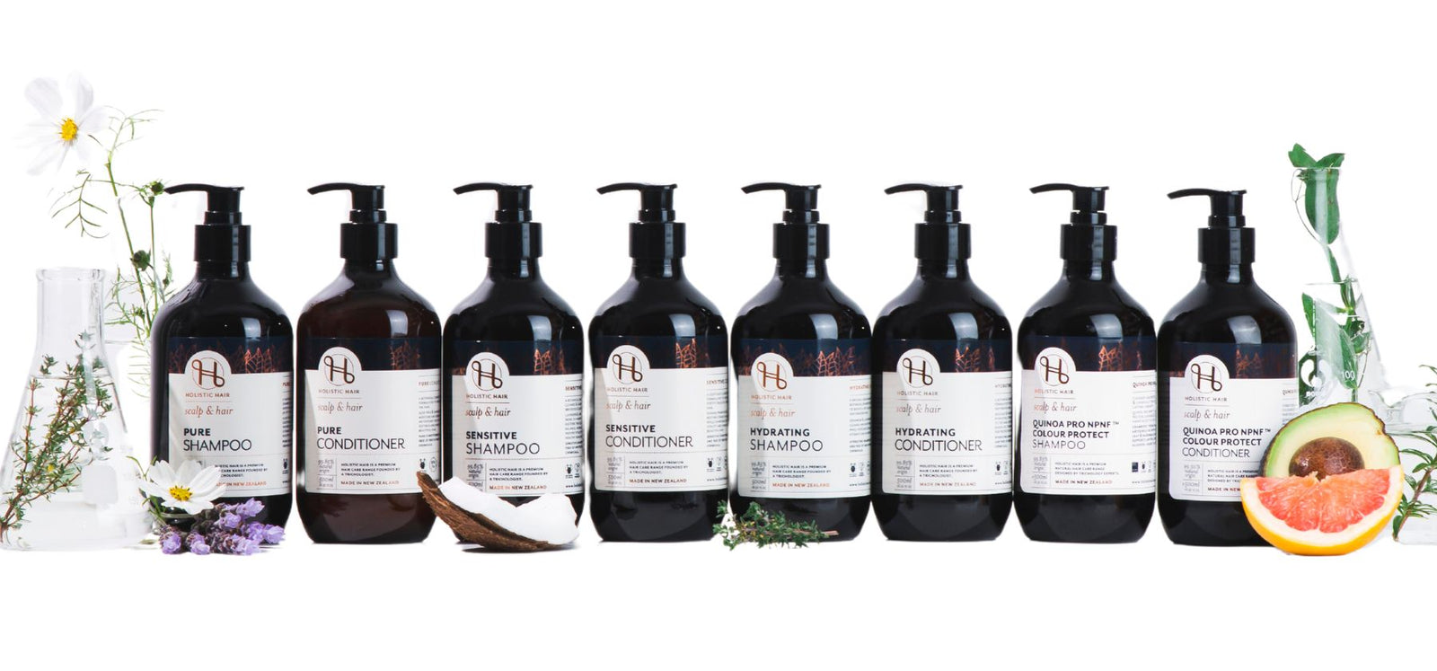 Holistic Hair 500ml range of Shampoos & Conditioners on a science background.