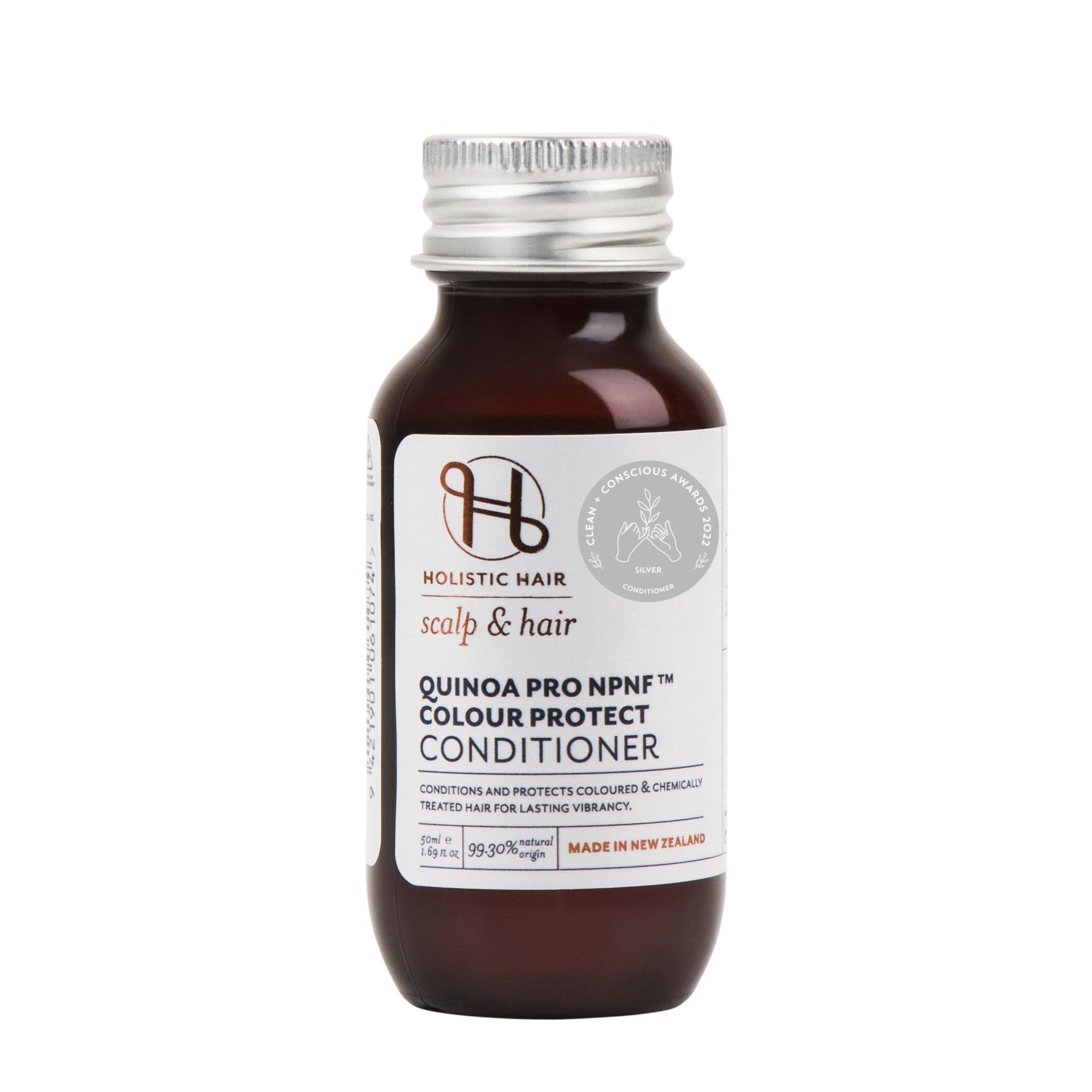 Bottle of Quinoa Pro NPNF™ Colour Protect Conditioner surrounded by natural ingredients like Murumuru butter, flax, and mango.